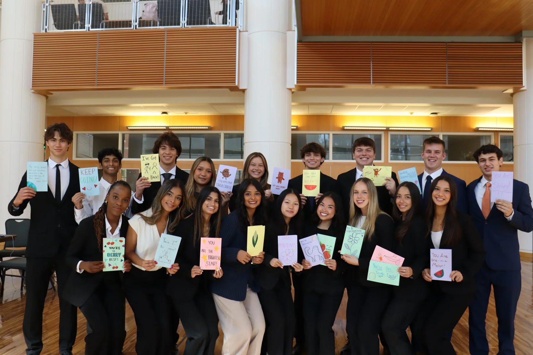 PCT members holding the cards they made together